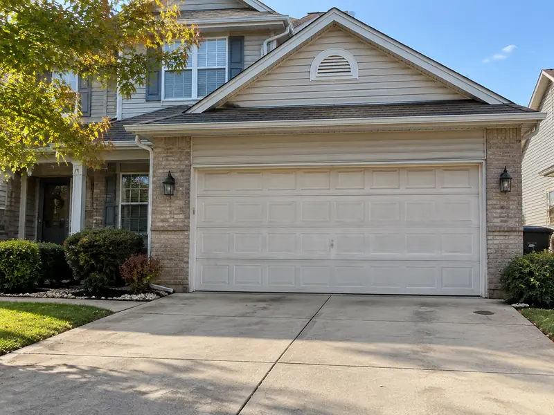 Original garage door on a 2000s-era home